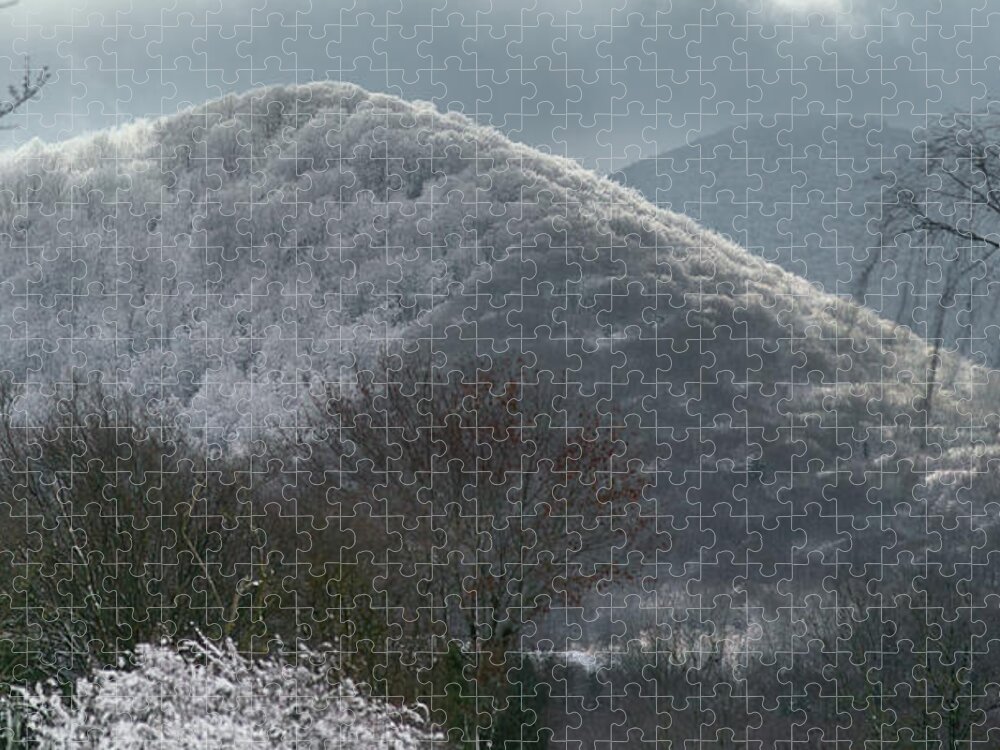 Autumn Jigsaw Puzzle featuring the photograph Light games between clouds and snow on the volcano by Jean-Luc Farges