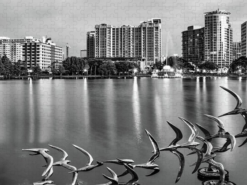 Orlando Skyline Jigsaw Puzzle featuring the photograph Orlando Skyline Taking Flight in Black and White Monochrome - Lake Eola Panorama by Gregory Ballos