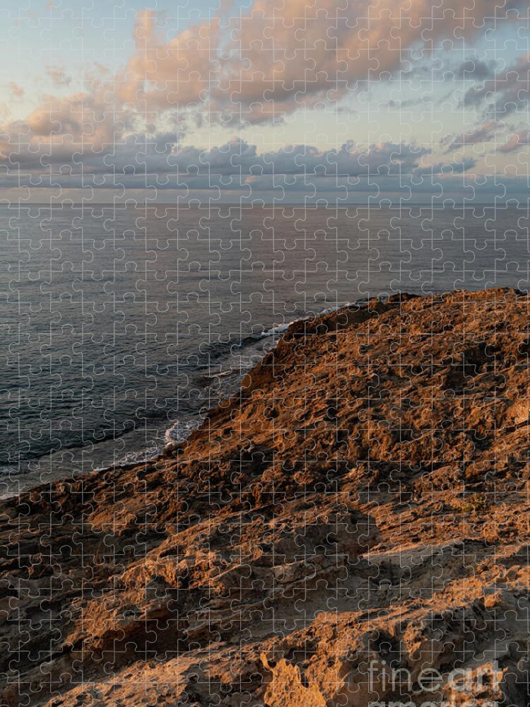 Mediterranean Sea Jigsaw Puzzle featuring the photograph Red-brown rocks and pink clouds on the Mediterranean Sea by Adriana Mueller