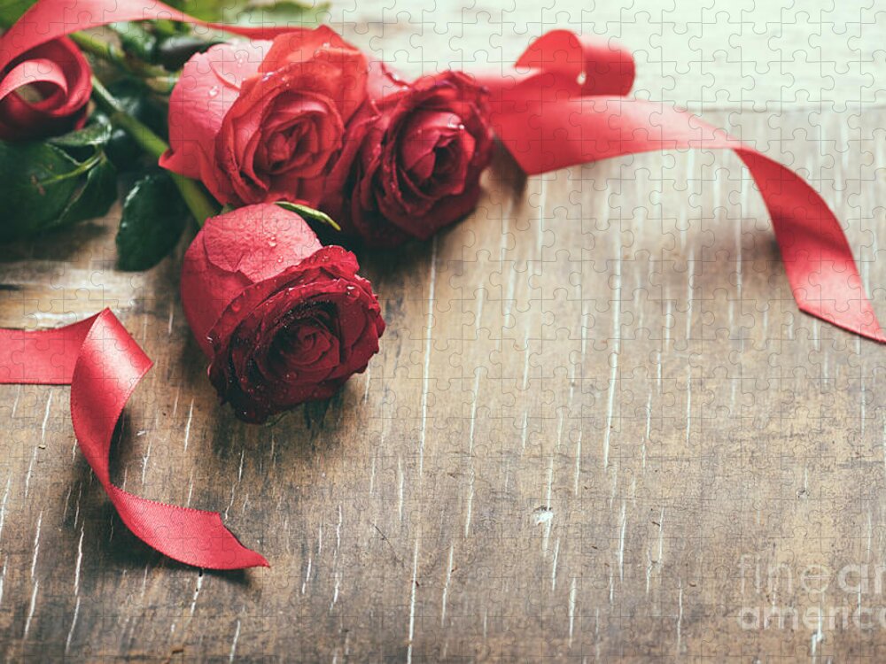 Roses Jigsaw Puzzle featuring the photograph Red roses with red ribbon on wooden table by Jelena Jovanovic