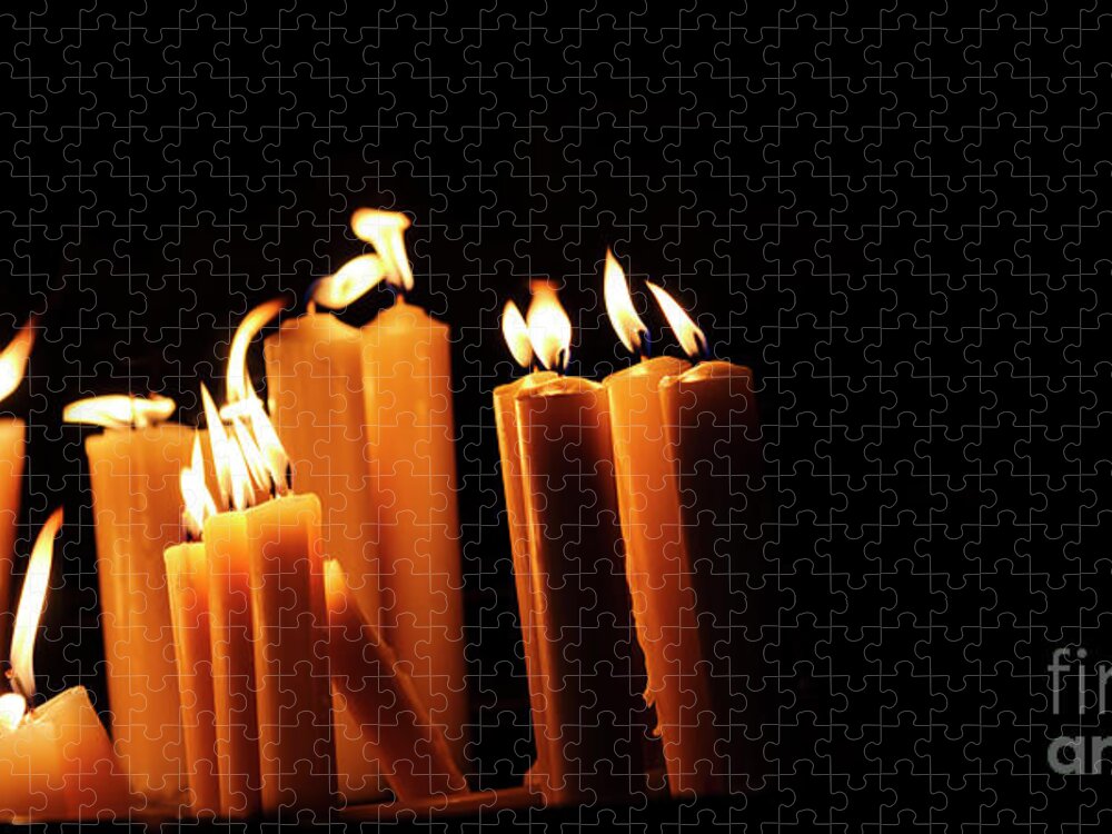 Candle Jigsaw Puzzle featuring the photograph Religious candles on black background. Yellow candlelight f by Jelena Jovanovic