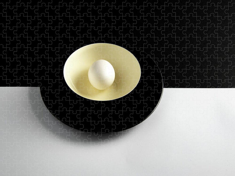 Still-life Jigsaw Puzzle featuring the photograph Single fresh white egg on a yellow bowl by Michalakis Ppalis