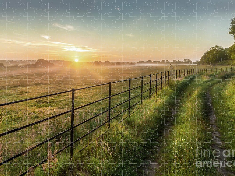 Norfolk Jigsaw Puzzle featuring the photograph Sunrise over rural fields fences and track in Norfolk UK by Simon Bratt
