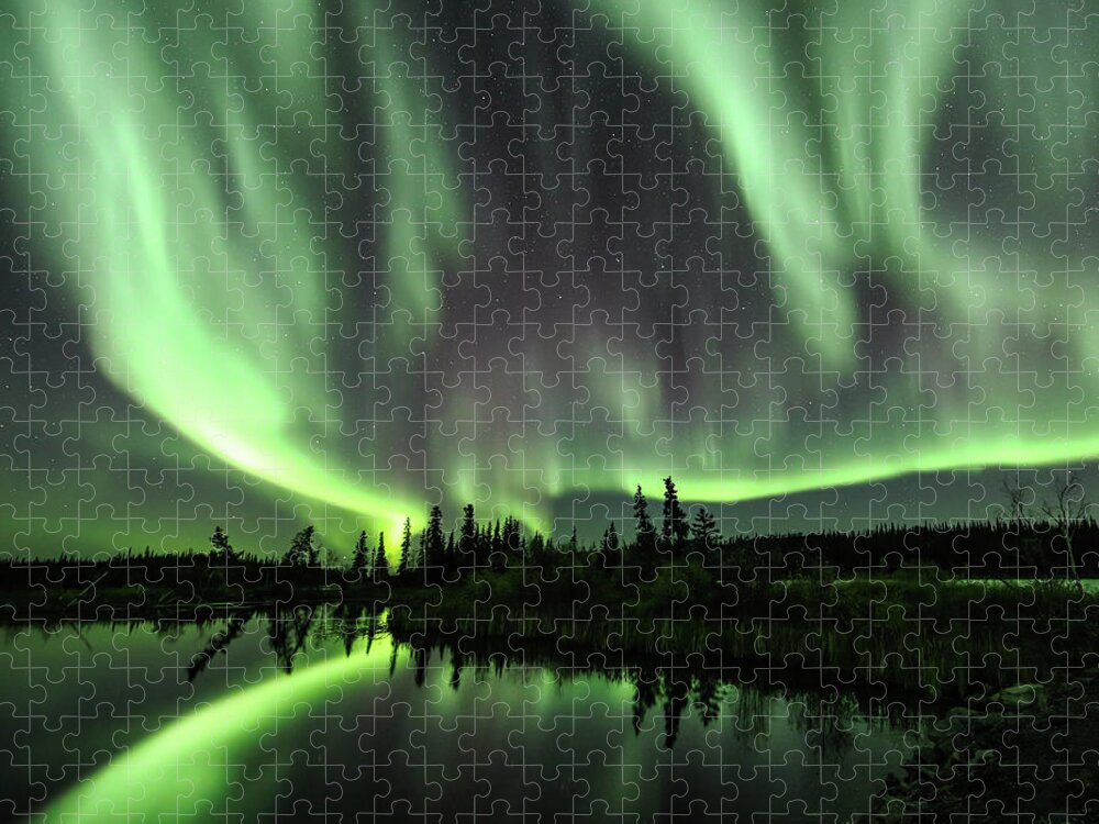 Northern Lights Jigsaw Puzzle featuring the photograph The Aurora Borealis fills the sky by Steven Upton