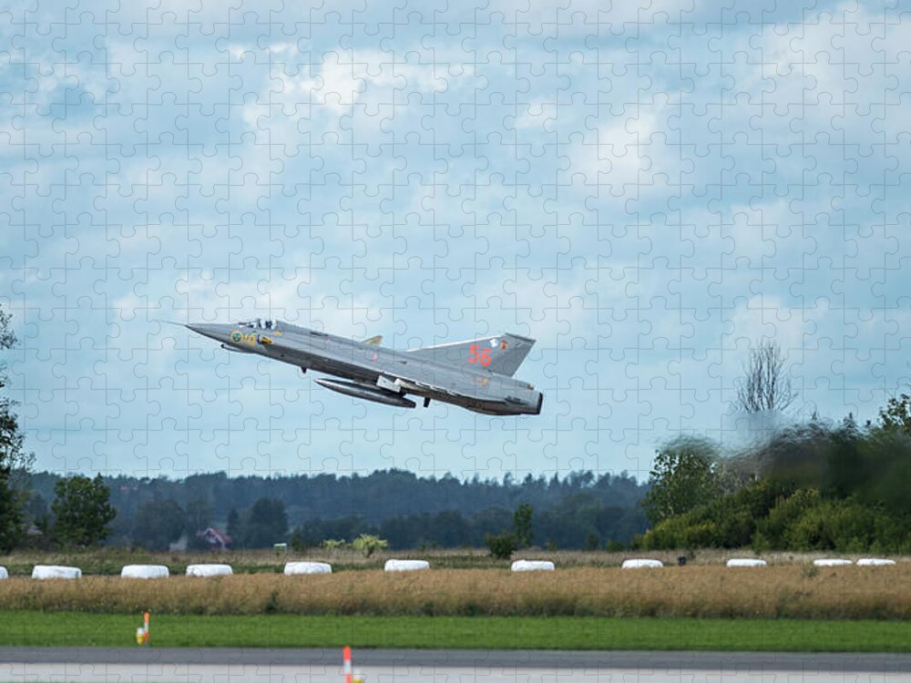 Take Off Jigsaw Puzzle featuring the photograph The retired J35 Draken take off and still going strong by Torbjorn Swenelius