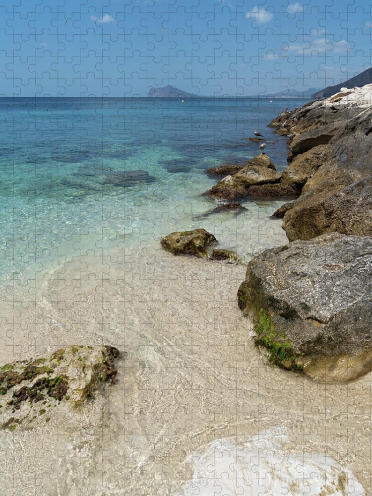Mediterranean Jigsaw Puzzle featuring the photograph Turquoise blue sea water and rocks in Calpe 1 by Adriana Mueller