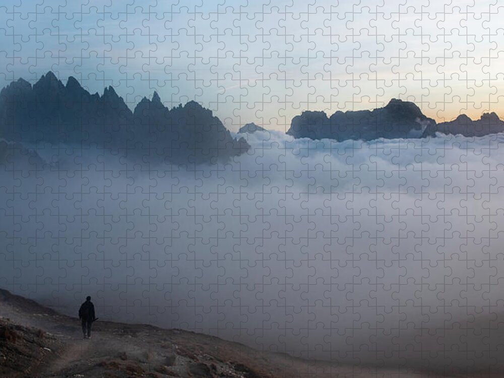 Italian Alps Jigsaw Puzzle featuring the photograph Unrecognized man trekking at the hiking path at Tre Cime in South Tyrol in Italy. by Michalakis Ppalis