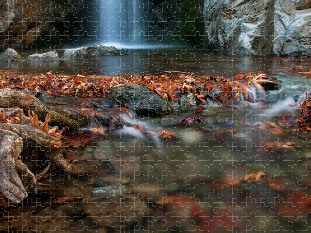 Troodos Jigsaw Puzzle featuring the photograph Waterfall and river flowing with maple leaves on the rocks on the river in Autumn by Michalakis Ppalis