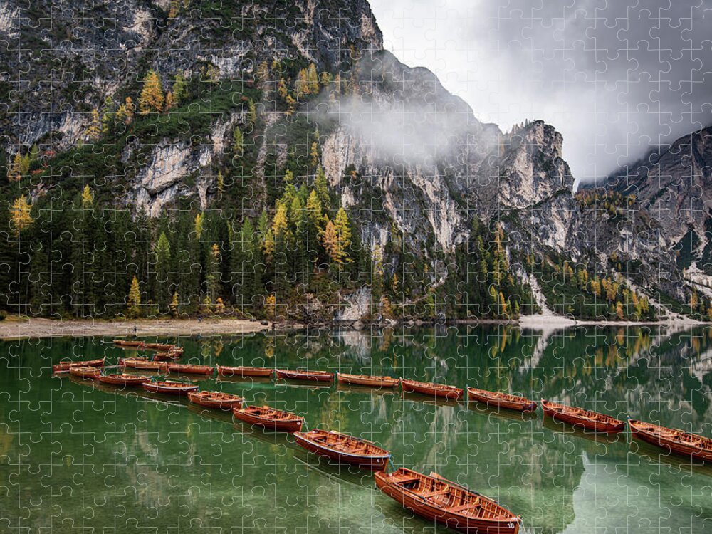 Lago Di Braies Jigsaw Puzzle featuring the photograph Wooden boats on the peaceful lake. Lago di braies, Italy by Michalakis Ppalis