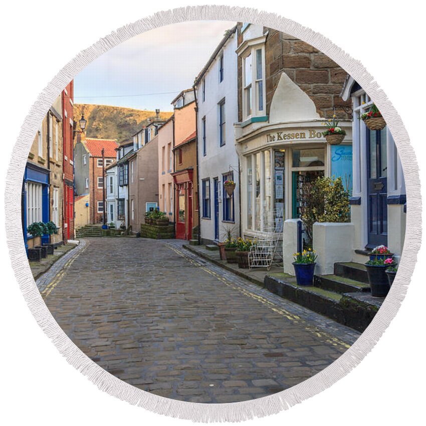 Architecture Round Beach Towel featuring the photograph Cobbles in Staithes by Sue Leonard
