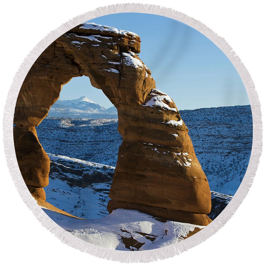 Arches Round Beach Towel featuring the photograph Delicate Arch with snow Arches National Park Utah #1 by Jason O Watson