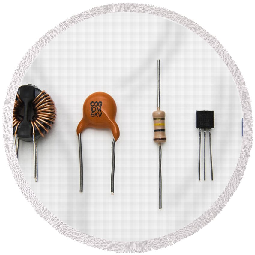 Inductor Round Beach Towel featuring the photograph Electronic Components #1 by GIPhotoStock