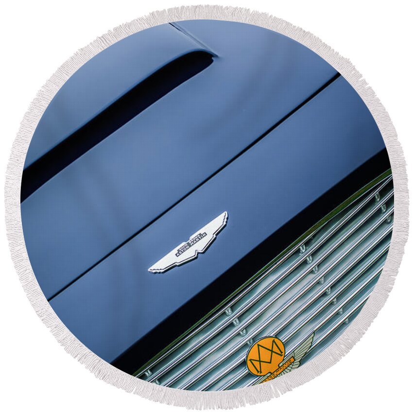 1965 Aston Martin Short Chassis Volante Hood Emblem Round Beach Towel featuring the photograph 1965 Aston Martin Short Chassis Volante Hood Emblem -1172c by Jill Reger