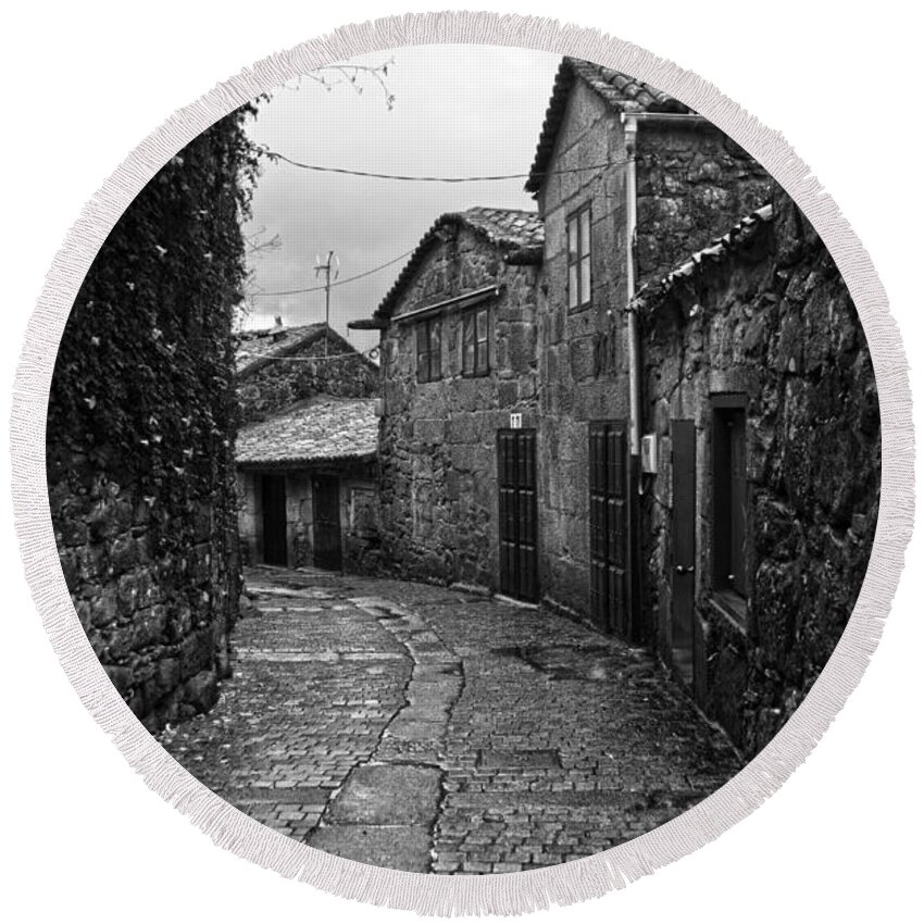 Ancient Round Beach Towel featuring the photograph Ancient street in Tui BW by RicardMN Photography