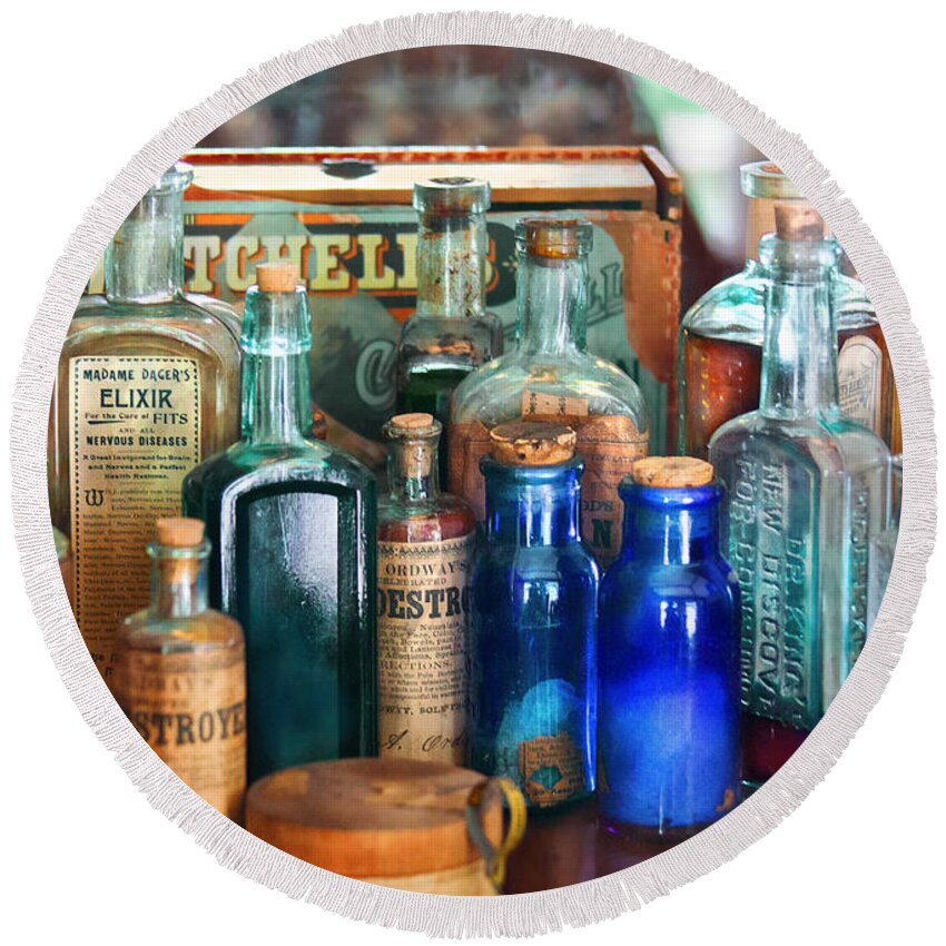 Pharmacy Round Beach Towel featuring the photograph Apothecary - Remedies for the Fits by Mike Savad