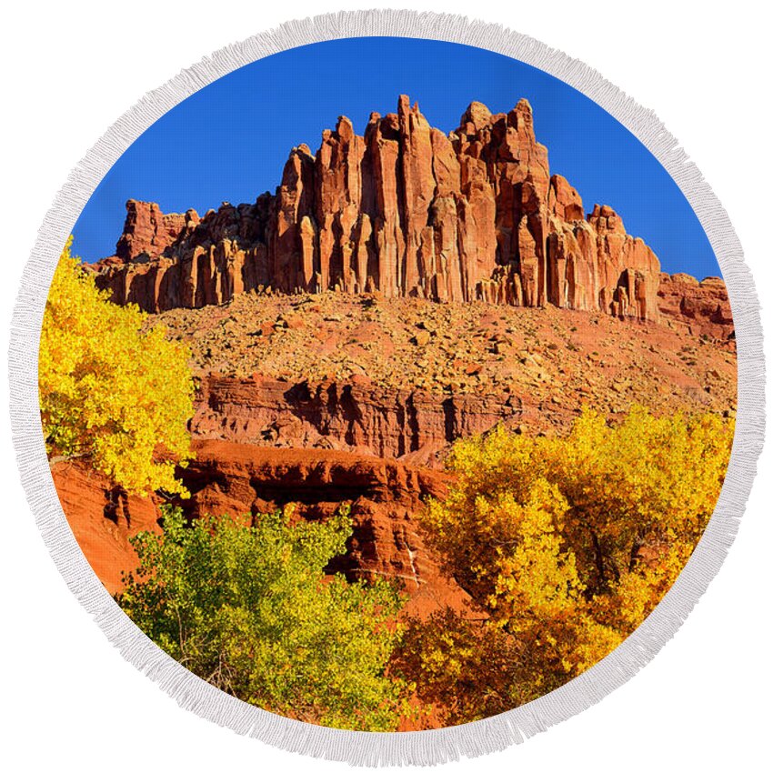Capitol Reef National Park Round Beach Towel featuring the photograph Autumn Beneath the Castle by Greg Norrell
