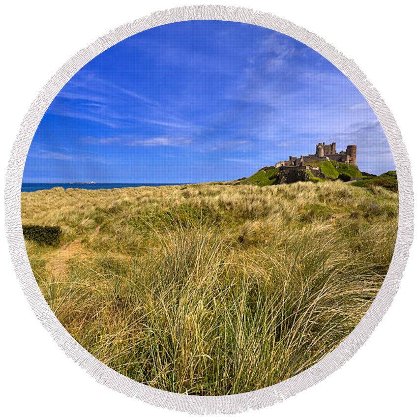 Travel Round Beach Towel featuring the photograph Bamburgh Castle by Louise Heusinkveld