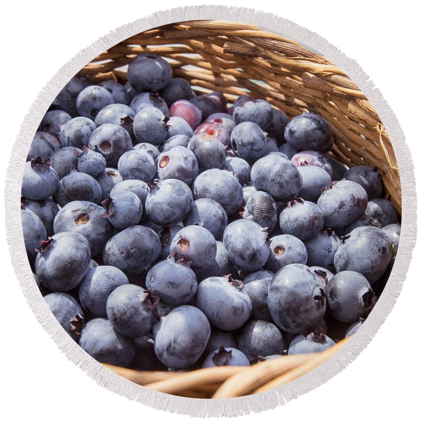Fruit Round Beach Towel featuring the photograph Basket of fresh picked blueberries by Edward Fielding