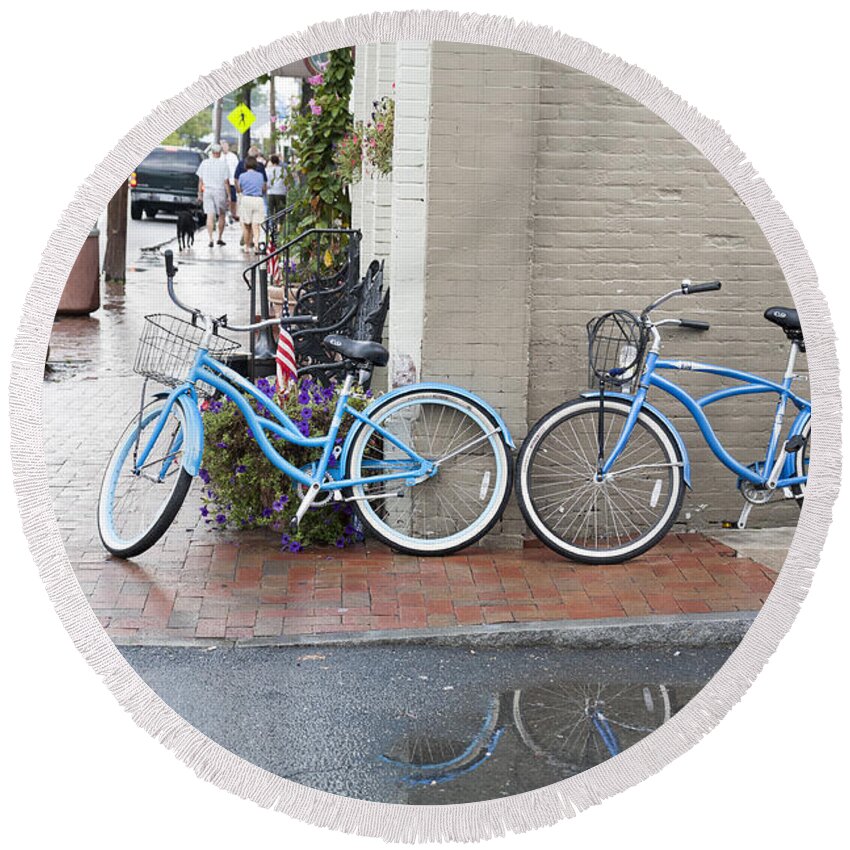 Bicycles Round Beach Towel featuring the photograph Bicycles parked along the main street in Saint Michaels Maryland. by William Kuta
