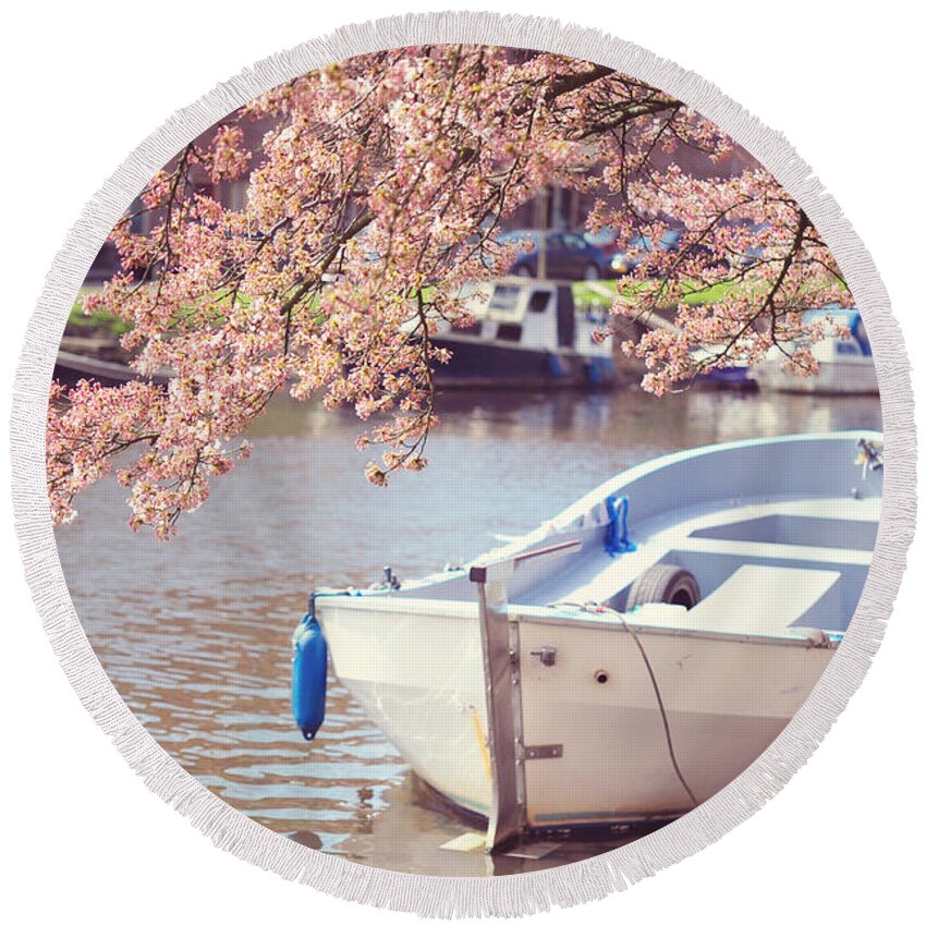 Spring Round Beach Towel featuring the photograph Boat Under Blooming Cherry Tree. Pink Spring in Amsterdam. by Jenny Rainbow