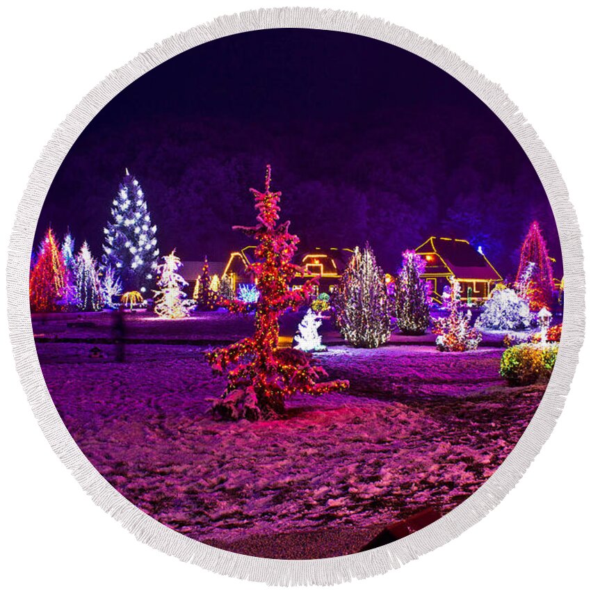 Christmas Round Beach Towel featuring the mixed media Christmas lights in town park - fantasy colors by Brch Photography