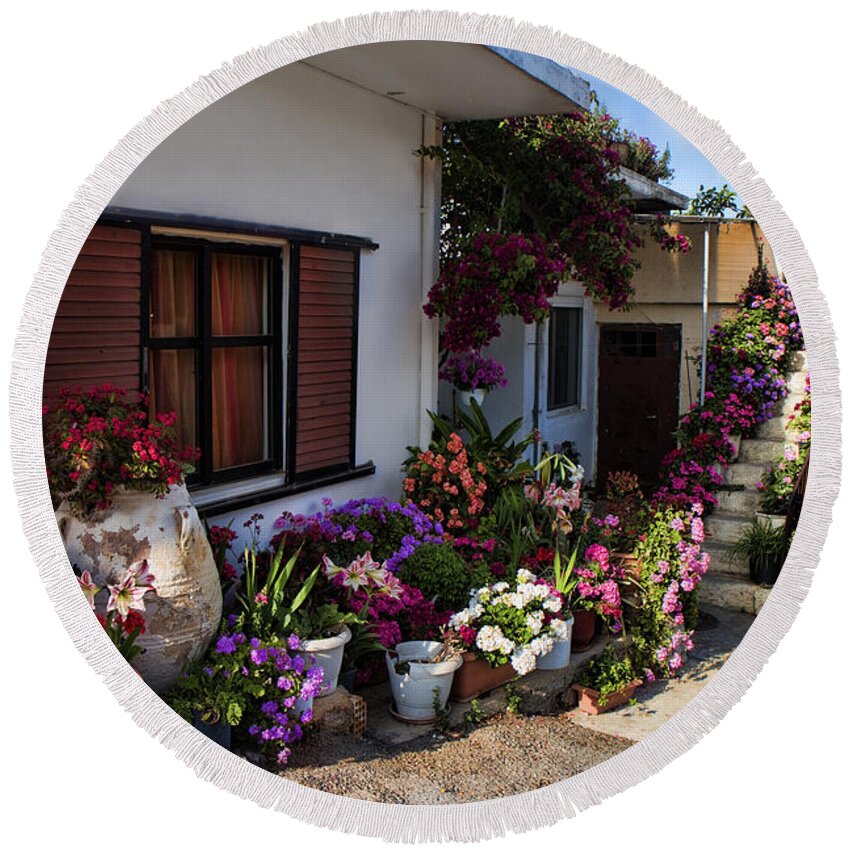 Flower Round Beach Towel featuring the photograph Colorful potted flower garden at a rural home in Crete by David Smith