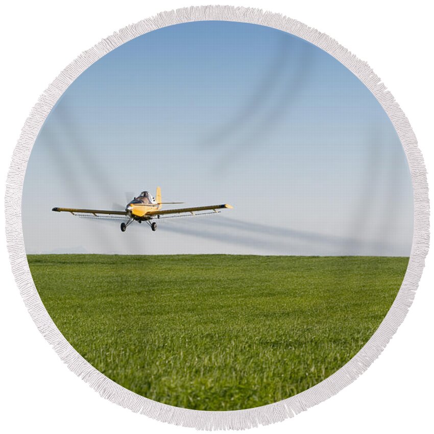 Plane Round Beach Towel featuring the photograph Crop Duster Airplane Flying Over Farmland by Cindy Singleton