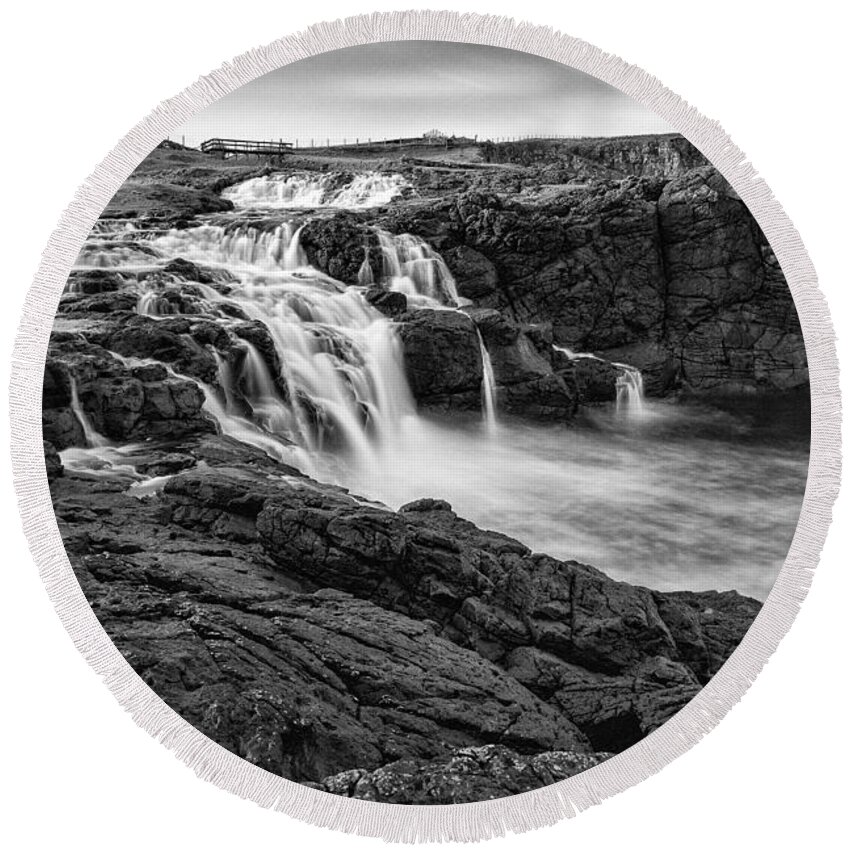 Dunseverick Round Beach Towel featuring the photograph Dunseverick Waterfall by Nigel R Bell