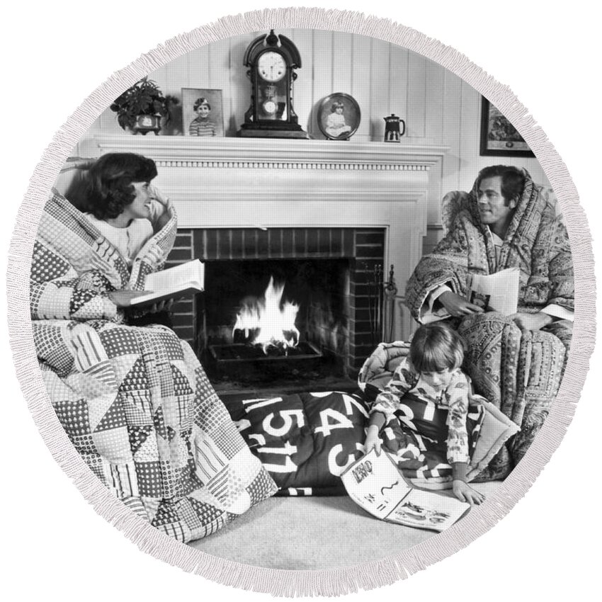 1970s Round Beach Towel featuring the photograph Family Huddled By Fireplace by Underwood Archives