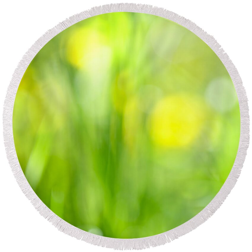 Green Round Beach Towel featuring the photograph Green grass with yellow flowers abstract by Elena Elisseeva