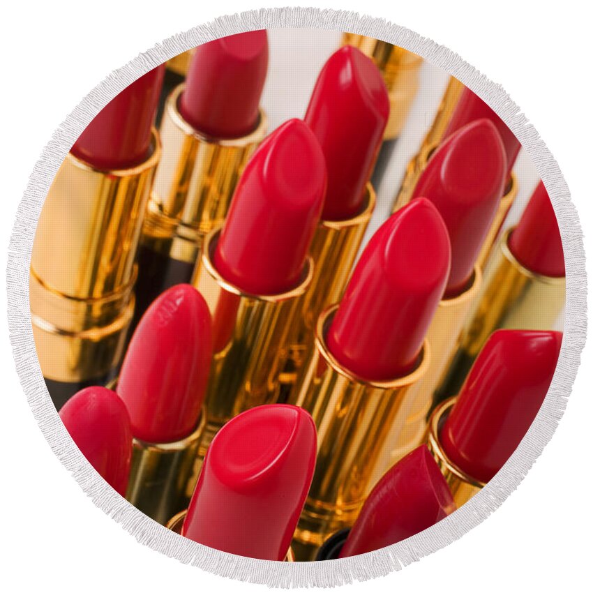 Cosmetics Round Beach Towel featuring the photograph Group of red lipsticks by Garry Gay