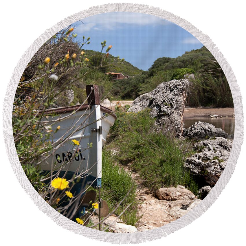 Blue Round Beach Towel featuring the photograph hidden caroline - In middle of cales coves menorca is a llaut hidden of curious sights by Pedro Cardona Llambias