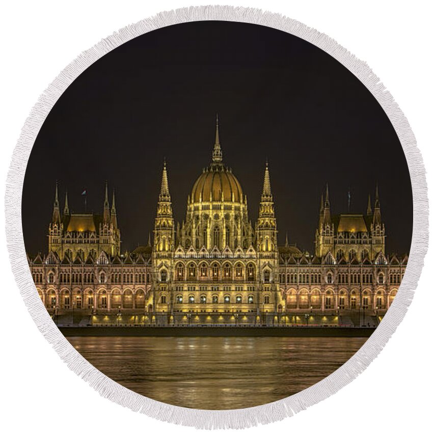Joan Carroll Round Beach Towel featuring the photograph Hungarian Parliament Building Night by Joan Carroll