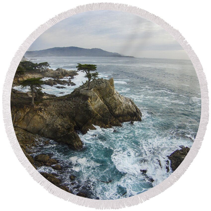 Above Round Beach Towel featuring the photograph Lone Cypress by David Levy