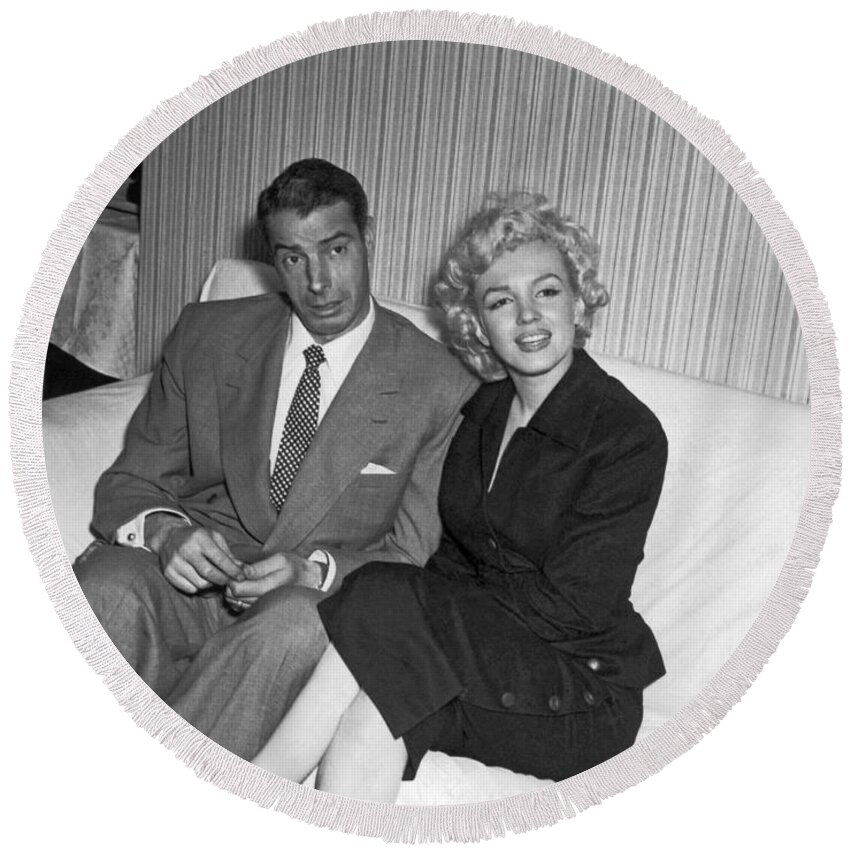 1954 Round Beach Towel featuring the photograph Marilyn Monroe And Joe DiMaggio by Underwood Archives