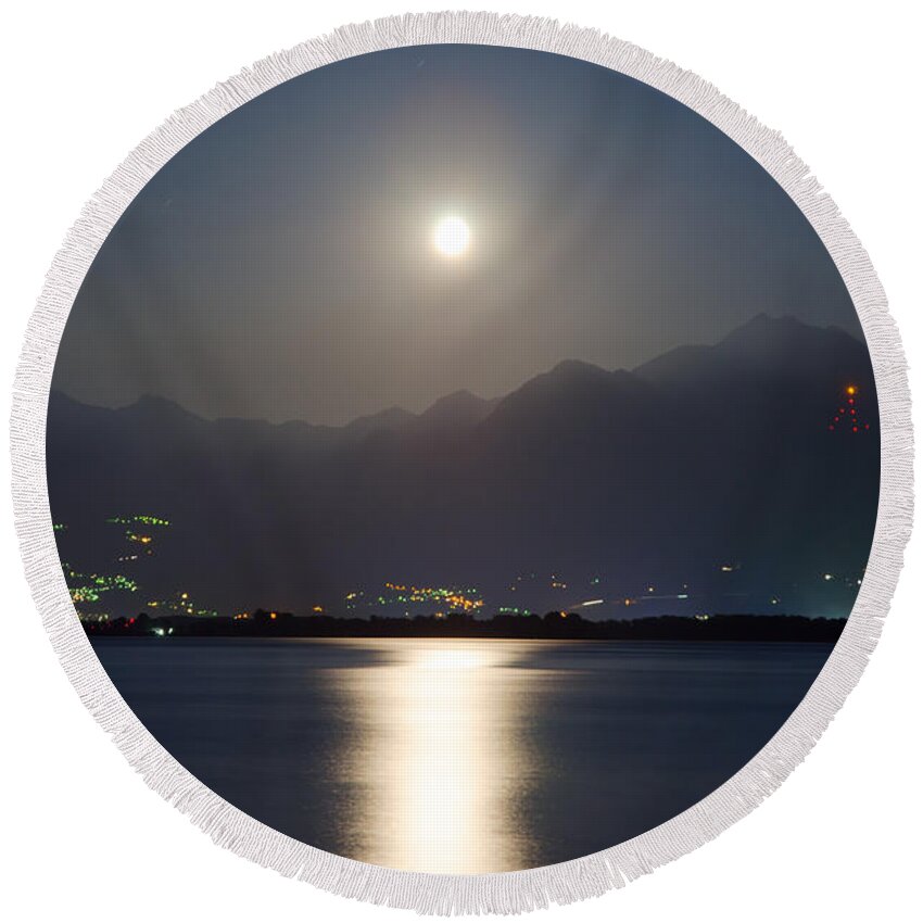 Moon Light Round Beach Towel featuring the photograph Moon light over a lake by Mats Silvan