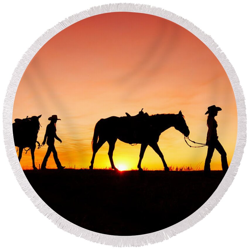 Cowgirls Silhouette Horses Sunset Sunrise Twilight Horizon Landscape Beautiful Sexy Sky Women Two Pair Girls Cowboys Rural Ranch Countryside Havre Montana Country Evening Saddle Outdoors Beauty Nature Sun Sunlight Orange American West Side View Yellow Dusk Dawn Leading Harness Halter Walking Agriculture Guest Ranch Recreation Femininity Young Feminine Legs Bright Back Lit Horizon Over Land Western West Great Plains Equine Quarter Horse Best Round Beach Towel featuring the photograph Off to the Barn by Todd Klassy