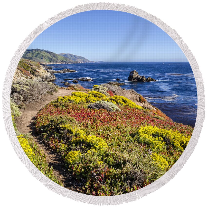 Big Sur California Pch Pacific Coast Highway Ocean Wildflowers Round Beach Towel featuring the photograph On The Side. by Wasim Muklashy