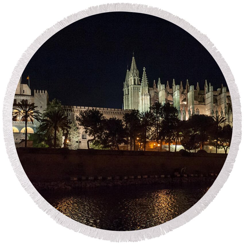 Gothic Achitecture Round Beach Towel featuring the photograph Palma cathedral Mallorca at night by Gary Eason