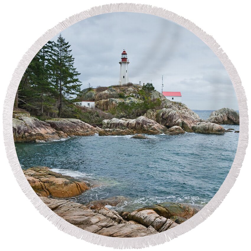 Architecture Round Beach Towel featuring the photograph Point Atkinson Lighthouse and Rocky Shore by Jeff Goulden