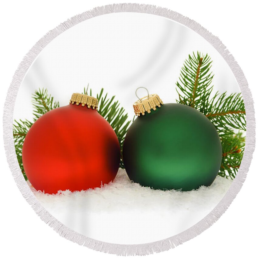 Christmas Round Beach Towel featuring the photograph Red and green Christmas baubles by Elena Elisseeva