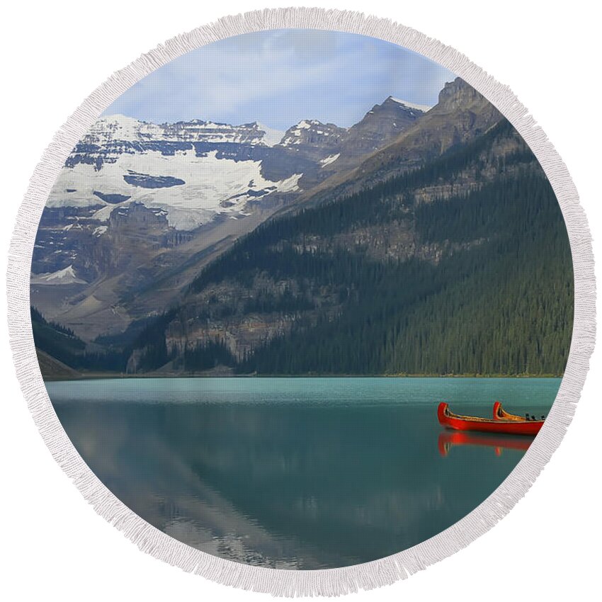 Canoe Round Beach Towel featuring the photograph Red Canoes on Lake Louise by Teresa Zieba