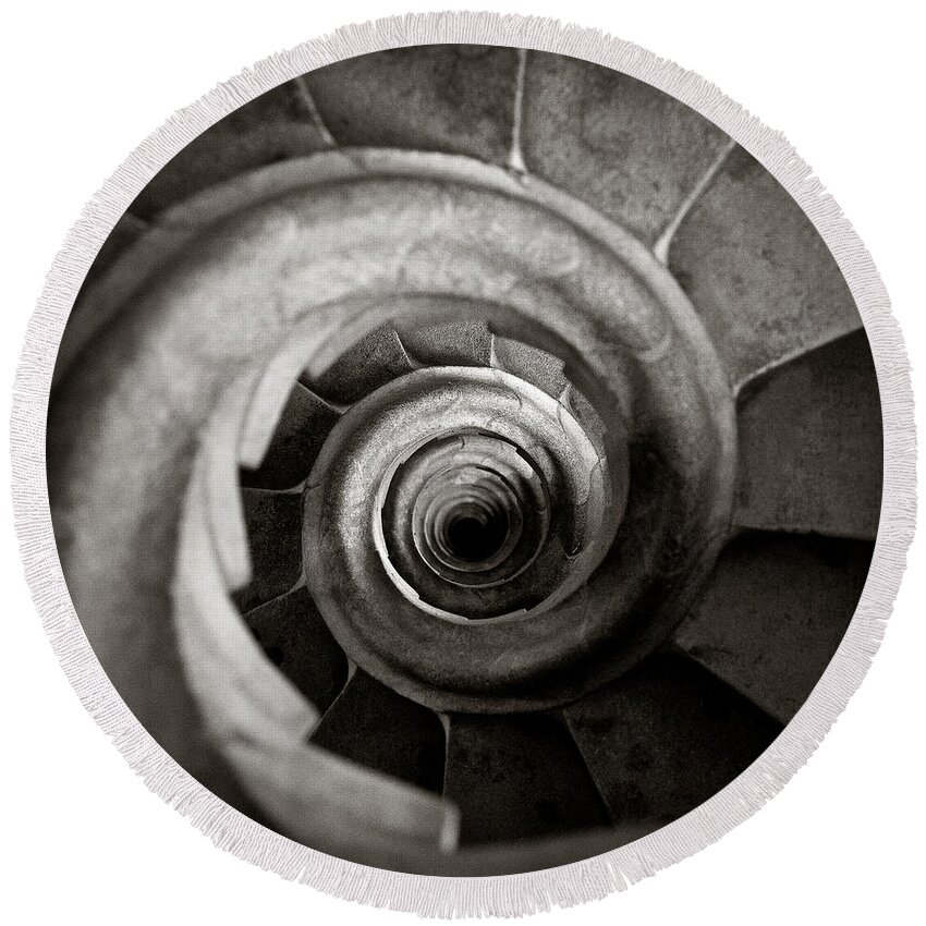 La Sagrada Familia Basilica Antoni Gaudi Spiral Steps Spiral Staircase Cathedral Architecture Barcelona Spiral Steps Stairs Stairway Stairwell Looking Down Landmark Famous Abstract Shapes Shell Design Catalonia Spain Stone Toned Gothic Church Holy Religion Staircase Tower Curve Perspective Snail Structure Swirl Geometric Circle Pattern View Sagrada Familia Down Floor Inside Turning Twisted Circular Old Monochrome Sepia Dave Bowman Photography Round Beach Towel featuring the photograph Sagrada Familia Steps by Dave Bowman