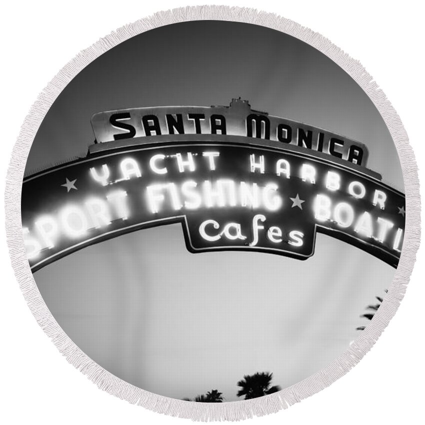America Round Beach Towel featuring the photograph Santa Monica Pier Sign in Black and White by Paul Velgos