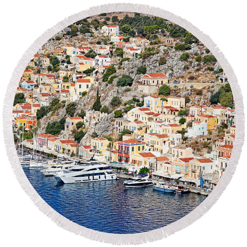 Aegean Round Beach Towel featuring the photograph The port of Symi - Greece by Constantinos Iliopoulos