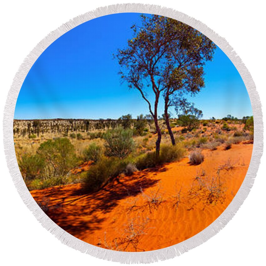 The Road To Uluru Outback Landscape Central Australia Australian Gum Tree Desert Arid Sand Dunes  Round Beach Towel featuring the photograph The Road to Uluru by Bill Robinson