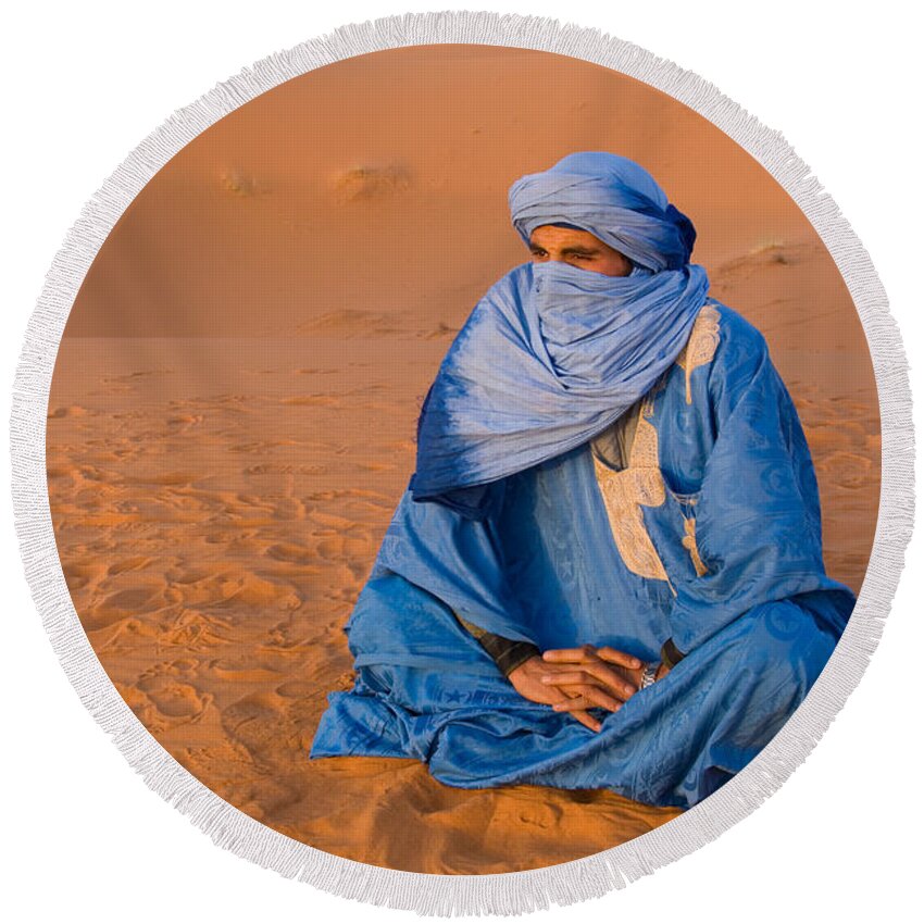 Photography Round Beach Towel featuring the photograph Veiled Tuareg Man Sitting Cross-legged by Panoramic Images