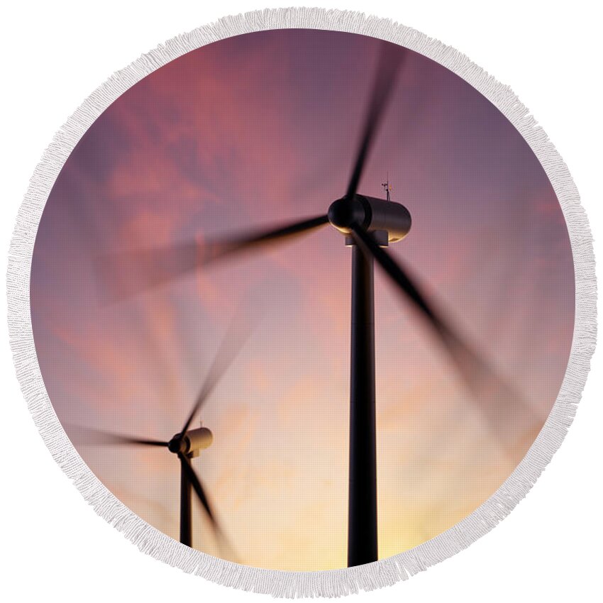 Wind Round Beach Towel featuring the photograph Wind Turbine blades spinning at sunset by Johan Swanepoel