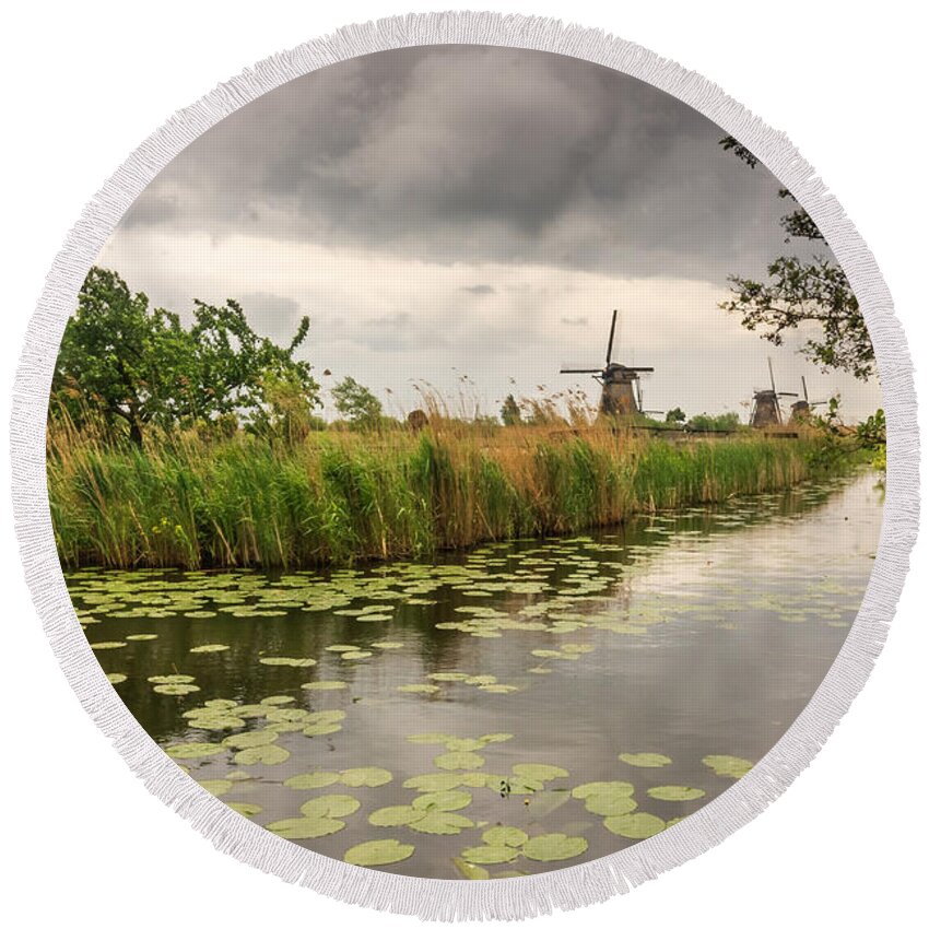 Bushes Round Beach Towel featuring the photograph Windmills by the canal by Sue Leonard
