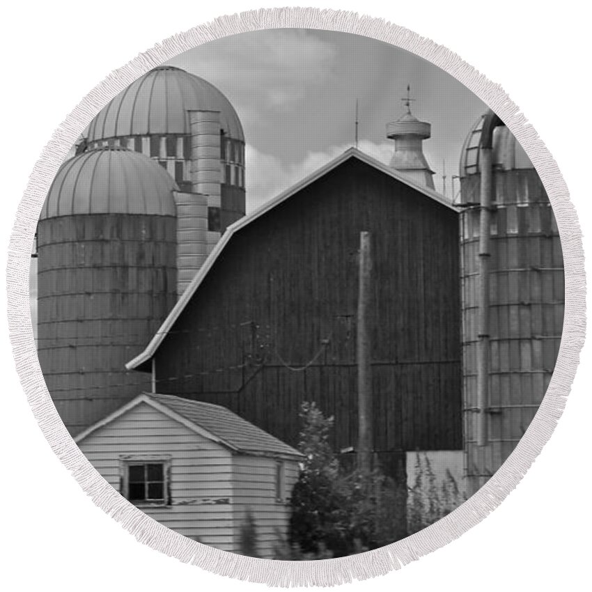 Black And White Round Beach Towel featuring the photograph Barns and Silos black and white by Pamela Walrath